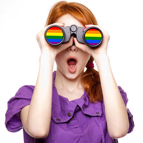 LGBTQ teen holding rainbow binoculars